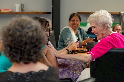 Welsh activity group guests laughing and chatting