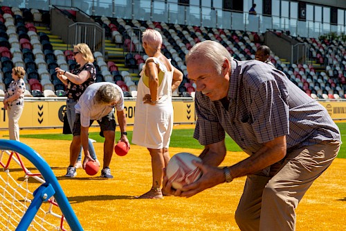 An activity group guest enjoying some gentle exercise