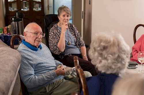 Tea party guests chatting
