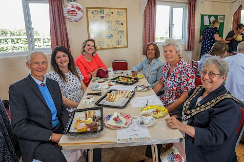 Guests celebrating at a tea party in Royal Wootton Bassett