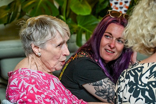Guests chatting at Chatsworth House tea party celebrating Re-engage's 60th anniversary