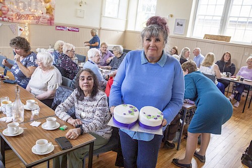 Lothian tea party guests with cakes