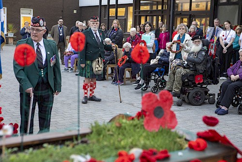 Tea party guests attending a Remembrance service in Stirling