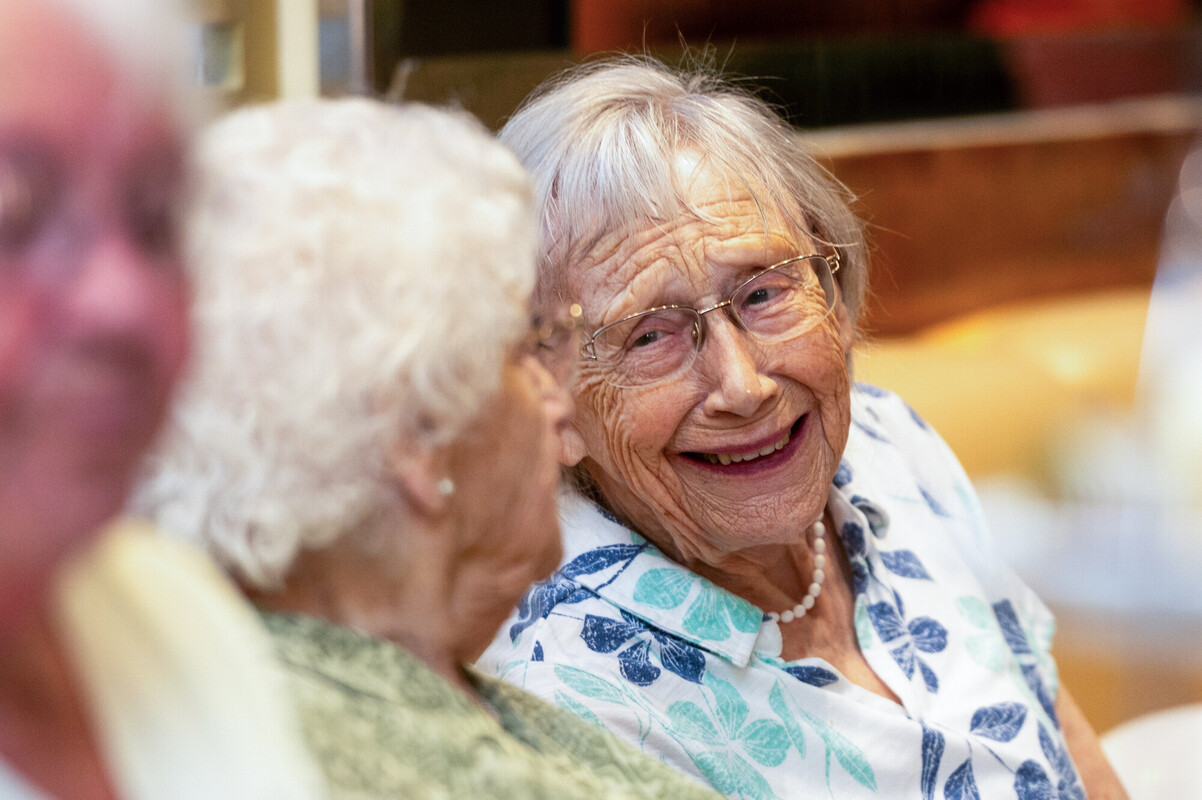 Two older people chatting